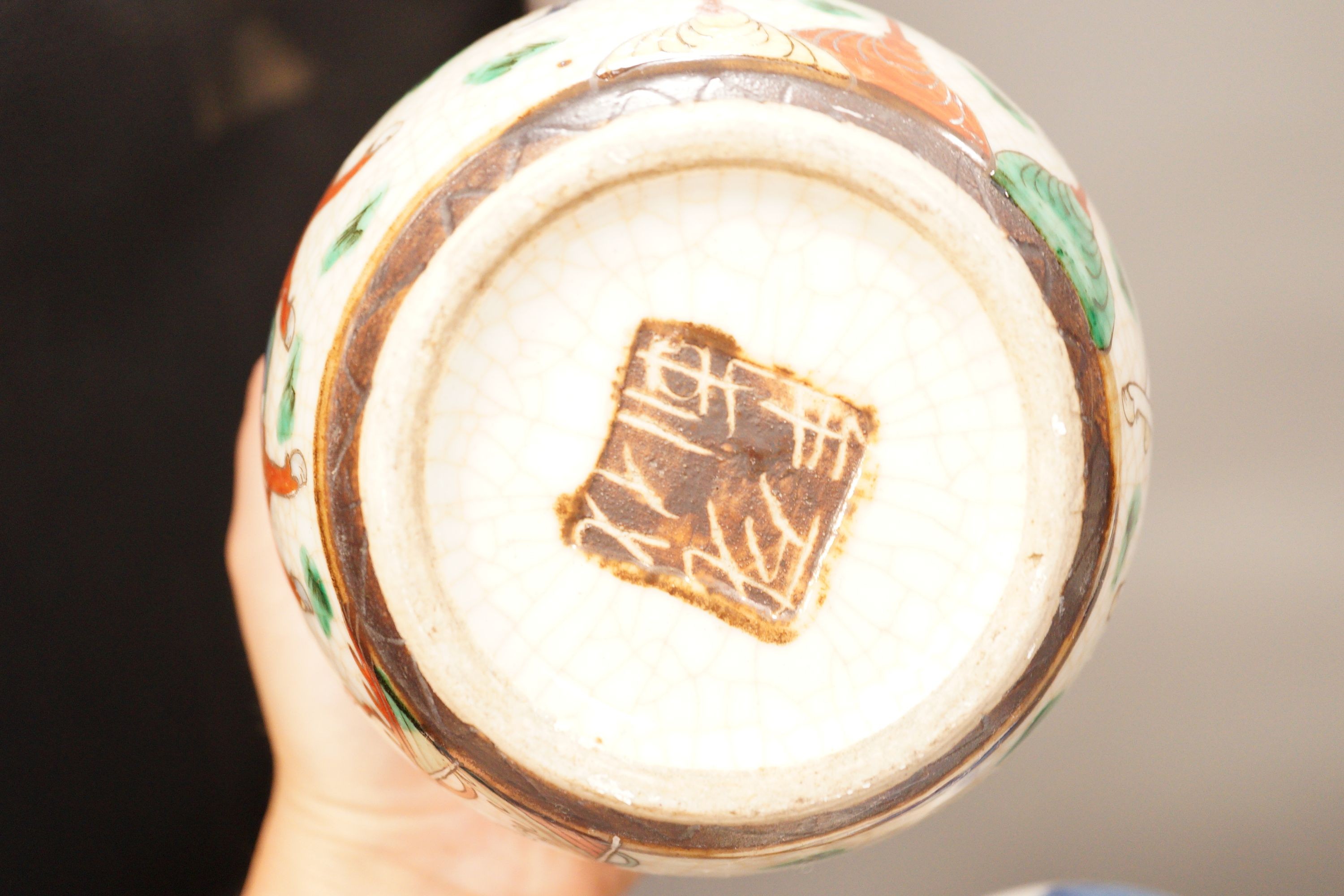 A Chinese crackleglaze famille rose jar and two blue and white jars, 16cm